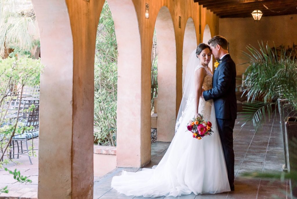 Portrait of bride and groom in the corridor of the Royal Palms wedding venue