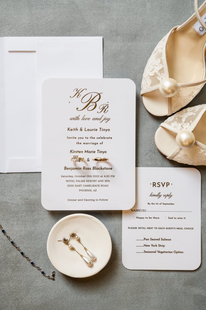 Flat Lay with wedding announcements, shoes and jewelry