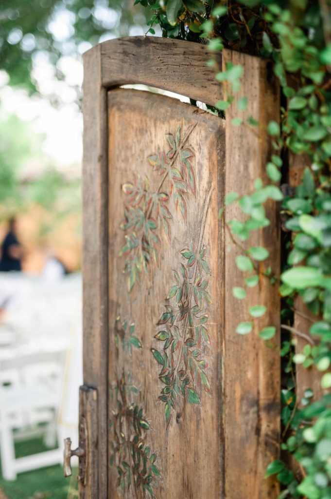 Royal Palms Resort Wedding ceremony entryway with wood door