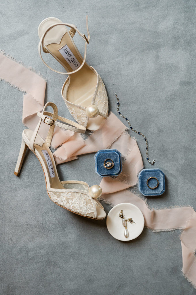 Flat lay with Shoes, rings and silk ribbon