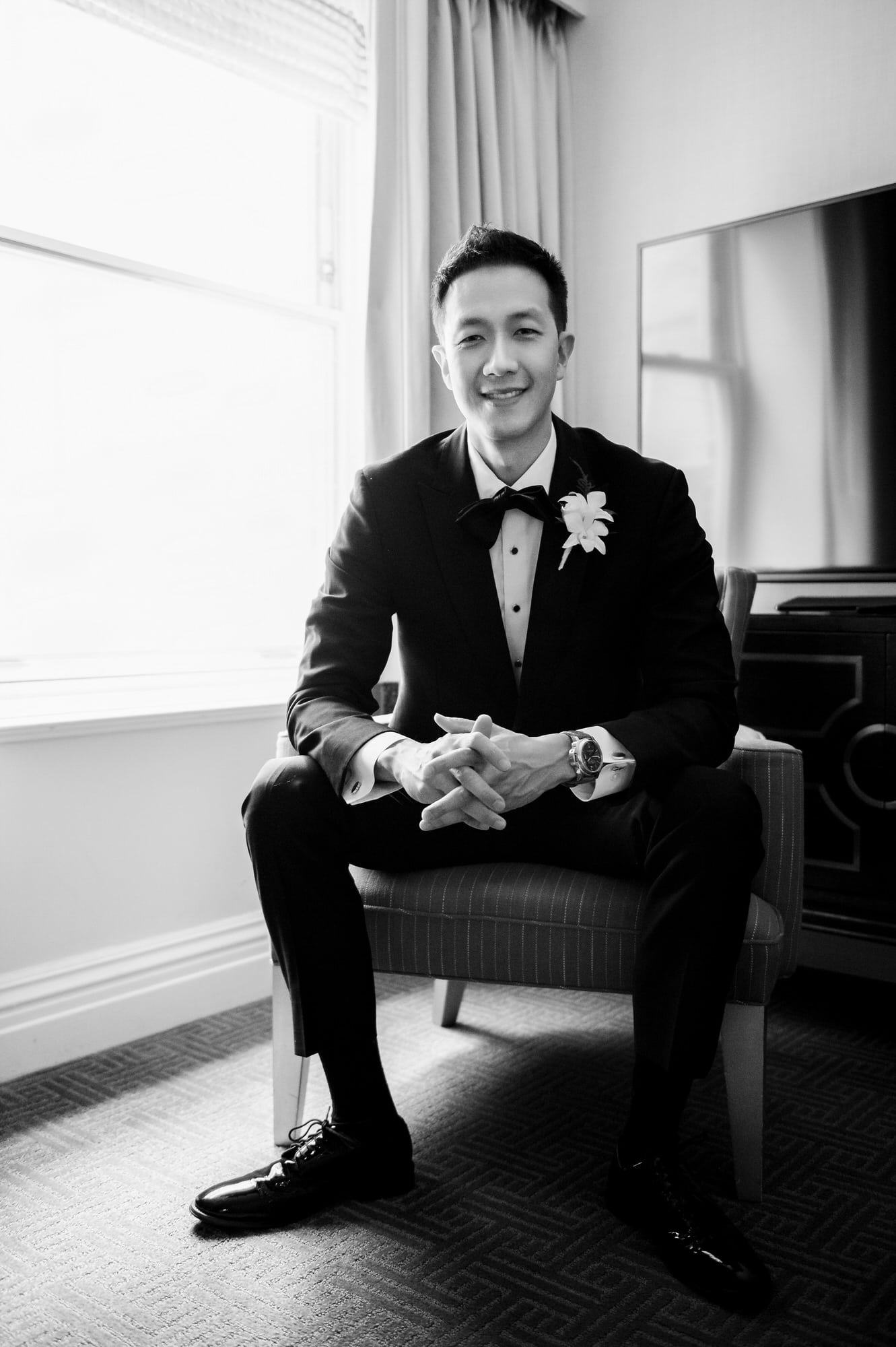 Groom sitting in chair at the Mayflower Hotel DC Wedding venue