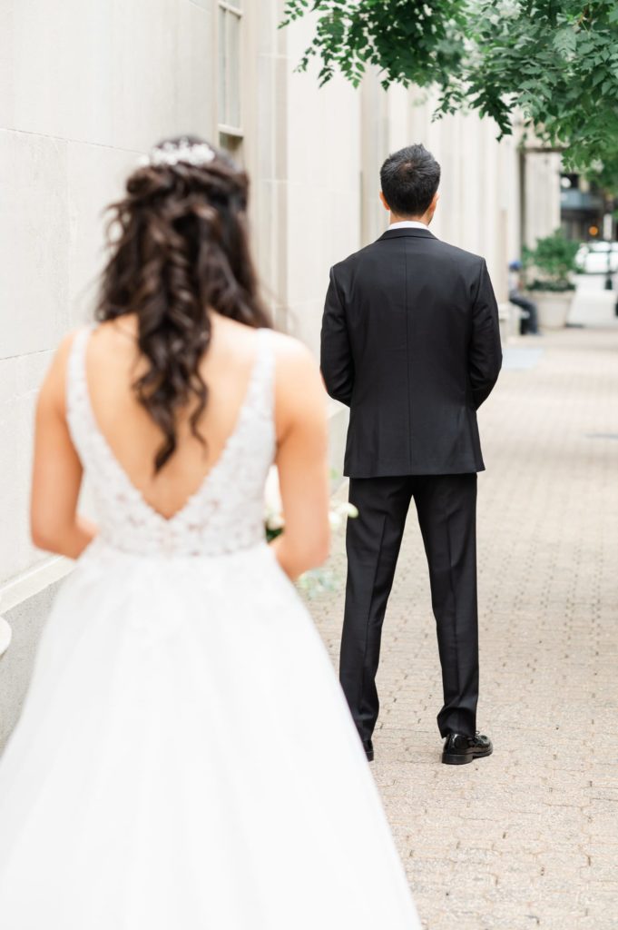 Brides perspective of the Bride and Groom first look on the sidewalk outside the Mayflower Hotel DC Wedding venue