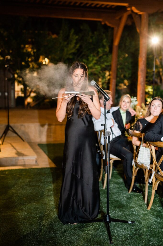 Maid of honor's toast blowing dust from a book 